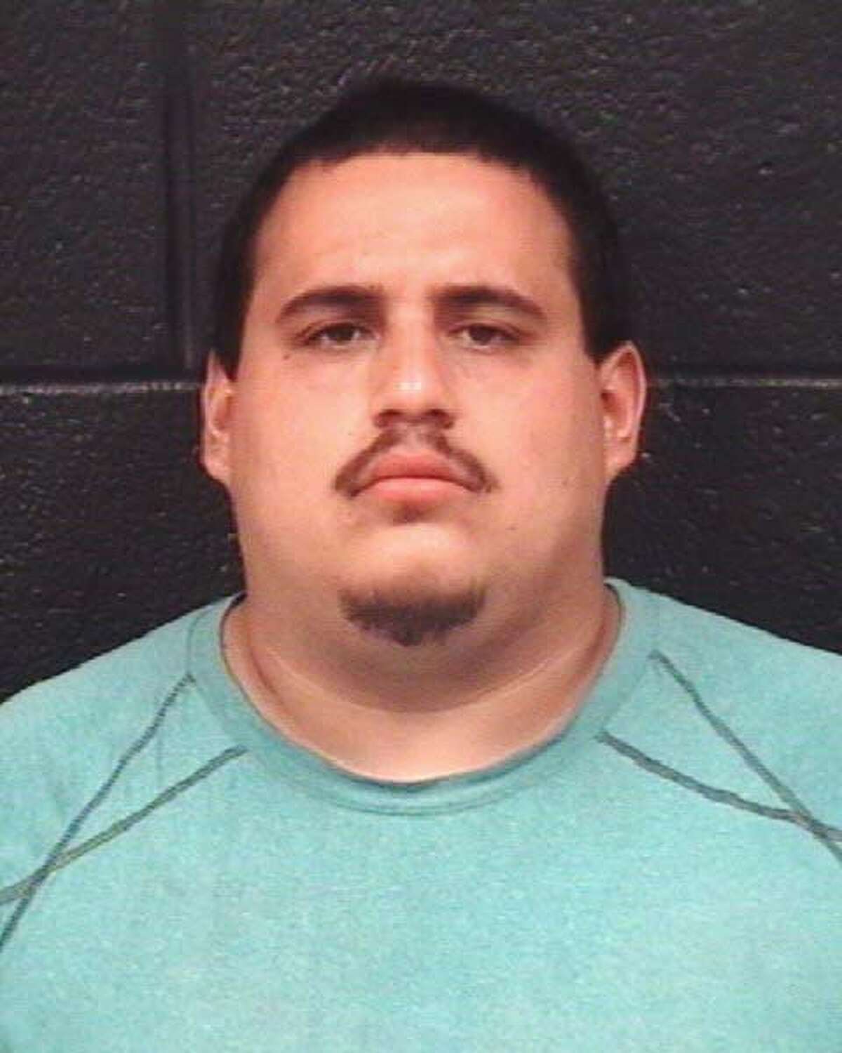 Mario Angel Gonzalez, 24, was arrested on a murder charge by Laredo police late Saturday.
