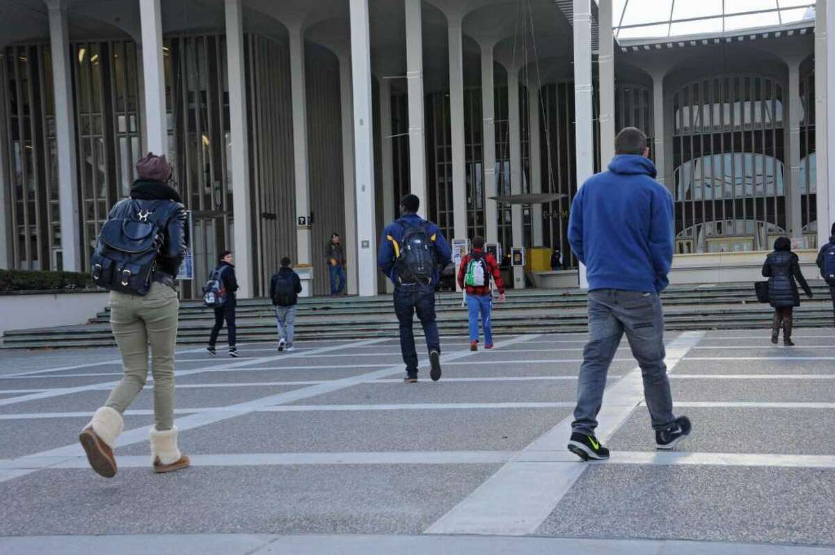 University at Albany students walk from classes at UAlbany Tuesday, Nov. 18, 2014