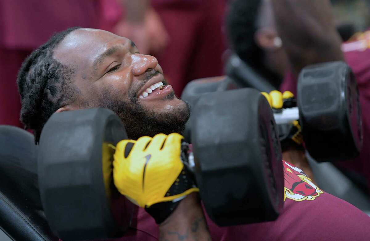 Ty Nsekhe lifts dumb bell that are 2 different weights during a private workout for a large portion of the Redskins Offensive line at O Athletik gym in Houston on July 11, 2017. MUST CREDIT: Washington Post photo by John McDonnell