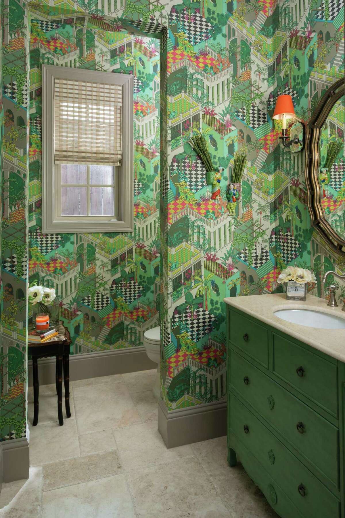 Pamela OâBrien, of Pamela Hope Designs, chose this wallpaper (Cole & Sons âMiamiâ pattern) for her powder bathroom. She said she wants guests to open the door and say âOh, wow. How fun!â