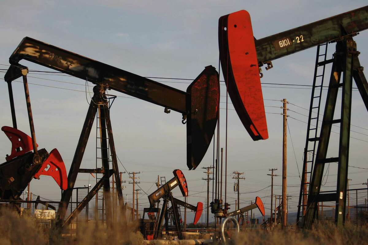 File photo of pump jacks and wells. Penn Virginia Corp. is buying nearly 20,000 acres in the Eagle Ford Shale oil field from Devon Energy in a deal worth $205 million, the companies announced Monday.