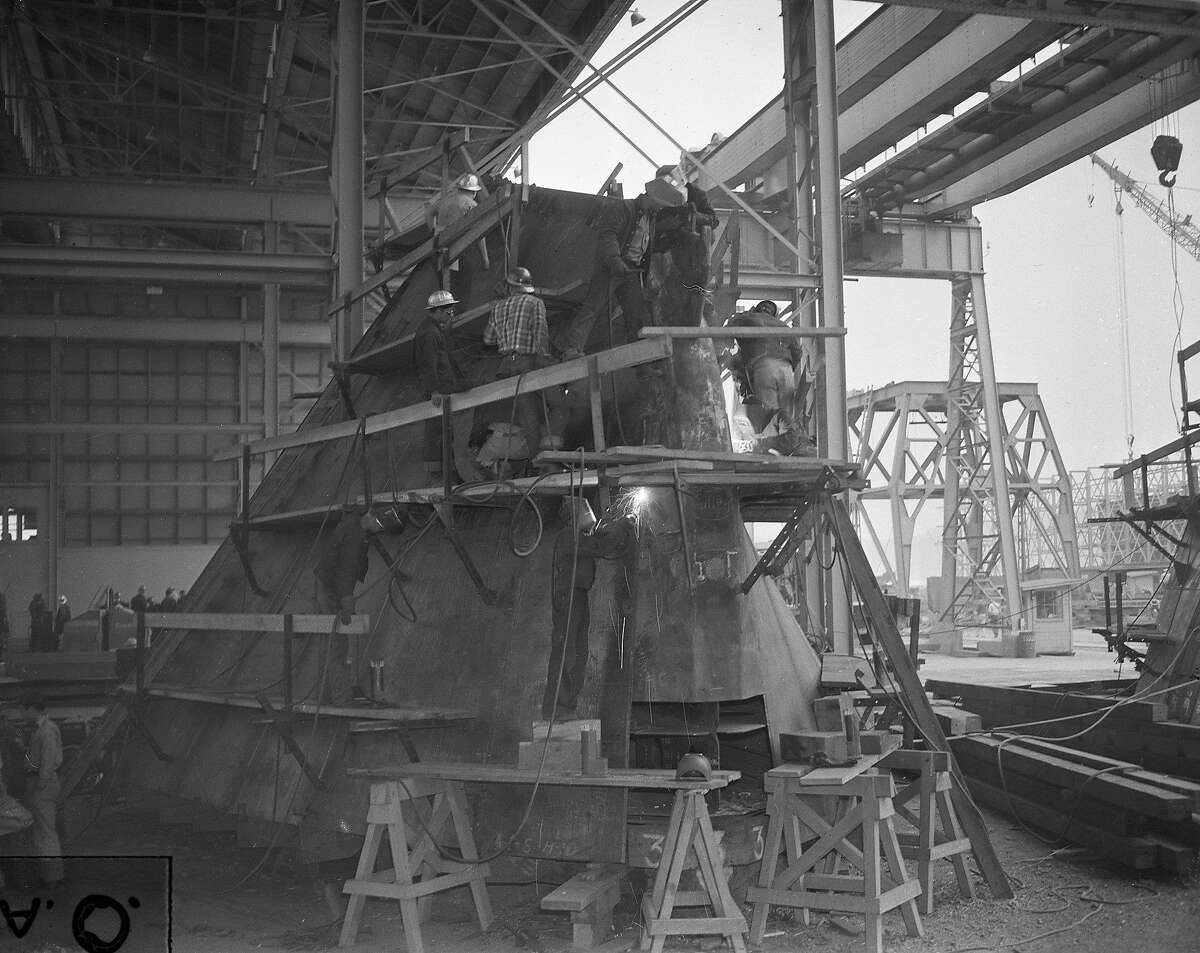 Workers building ships at Marinships
