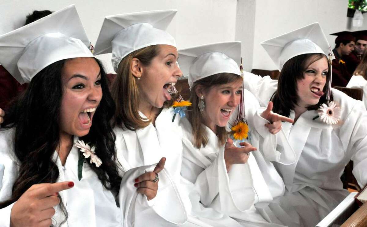 Graduates have a lighthearted moment just before Wooster School Commencement in Danbury, on Saturday, June 12, 2010. From left are Laura Chautin, Chloe Woodhouse, Annie Keeler, and Katie Kelly.