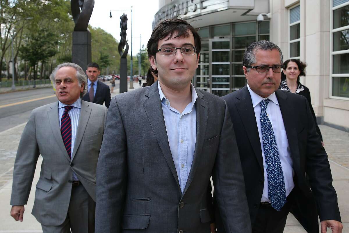 Martin Shkreli, former chief executive officer of Turing Pharmaceuticals, center, exits federal court with his attorney Benjamin Brafman, left, in New York in 2017.
