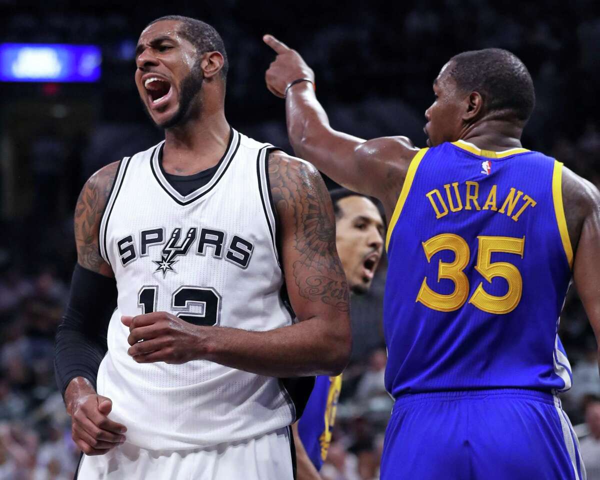 Golden State Warriors' Kevin Durant and San Antonio Spurs' LaMarcus Aldridge react to an Aldridge turnover in 2nd quarter during Game 3 of NBA Western Conference Finals at AT&T Center in San Antonio, Texas, on Saturday, May 20, 2017.