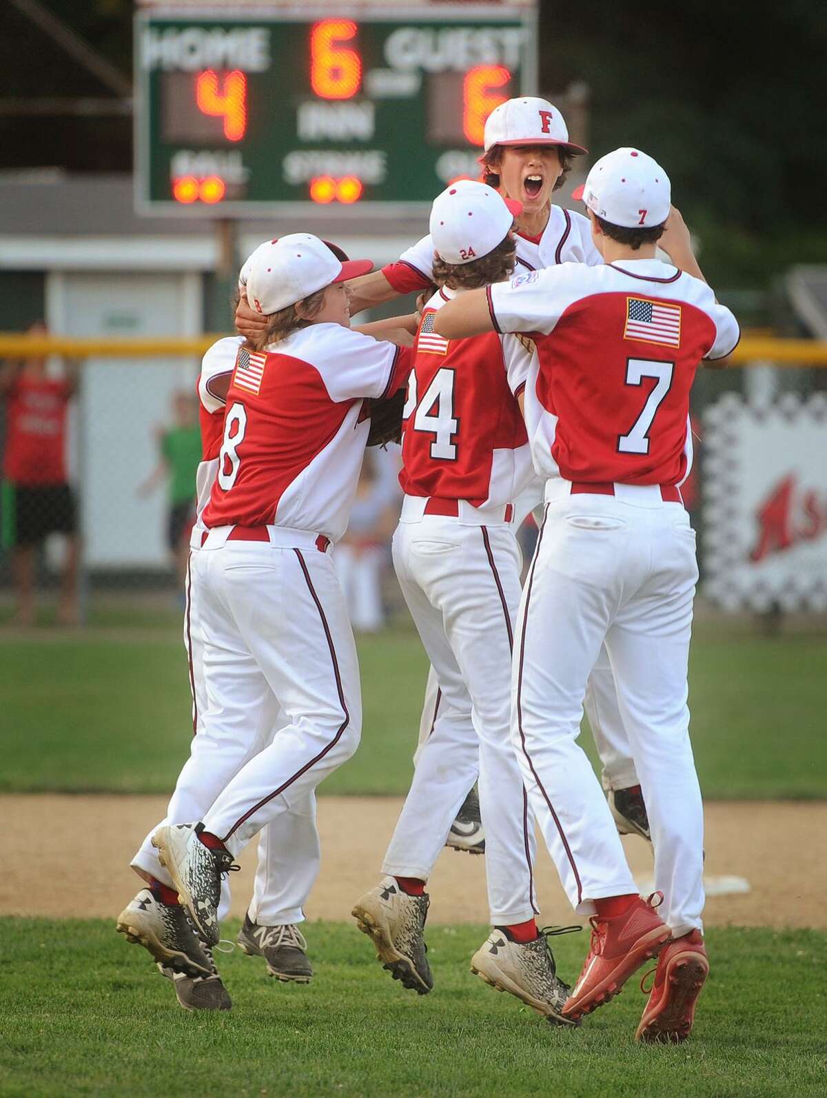 The Fairfield American baseball team celebrates their 6-4 victory over Newington in the Little League State Championship in Guilford, Conn. on Monday, July 31, 2017.