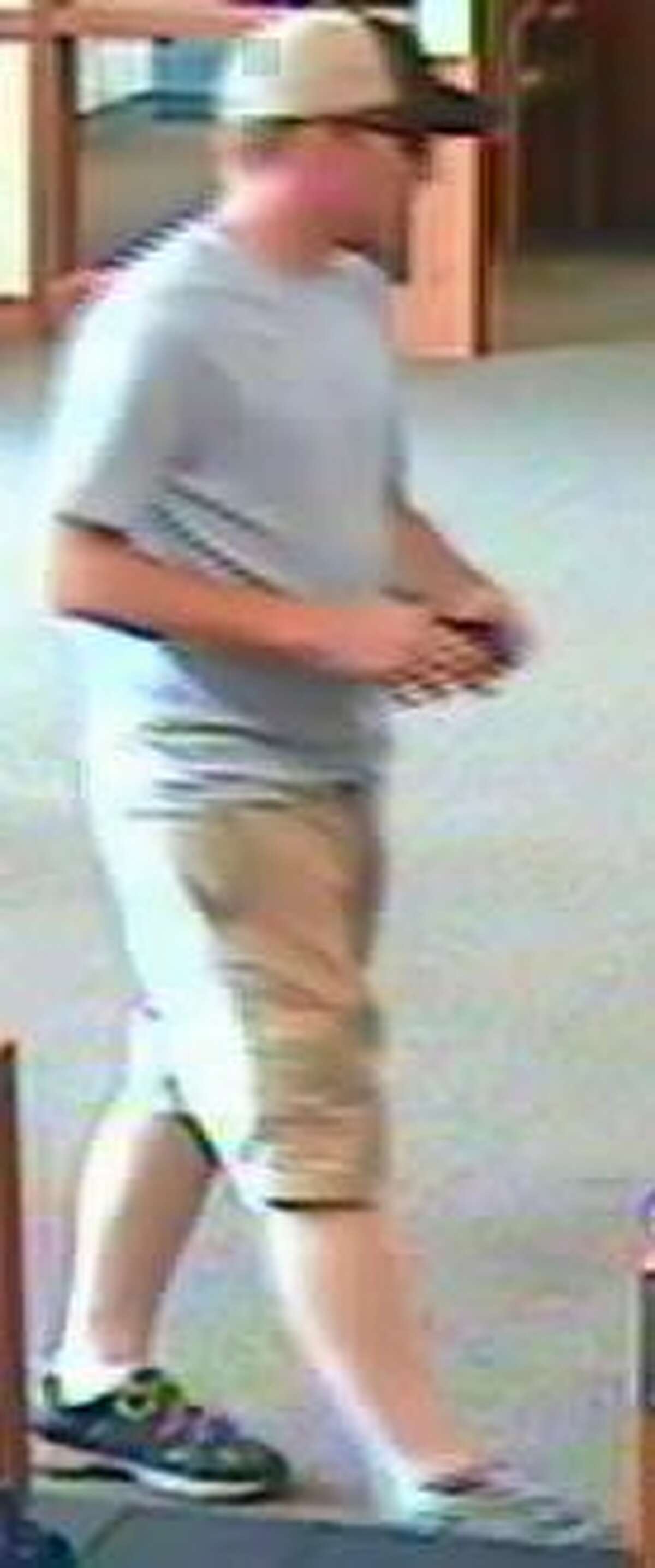 Pictured is a full-body shot of the suspect from yesterday's robbery at First Mid-Illinois Bank and Trust.