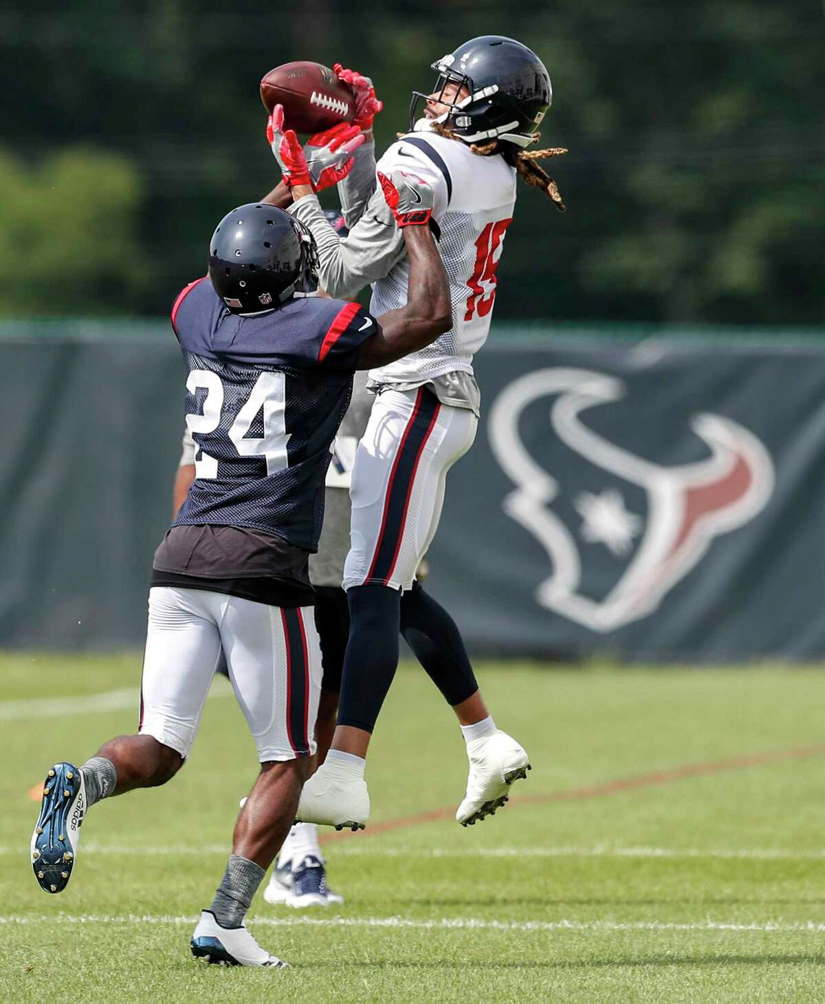 Houston Texans cornerback Johnathan Joseph (24) defends a pass to wide receiver Will Fuller (15) during training camp at the Greenbrier on Tuesday, Aug. 1, 2017, in White Sulphur Springs, W.Va.