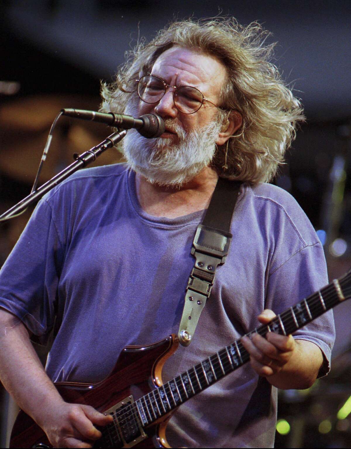FILE--Legendary rock icon Jerry Garcia died early Wednesday, Aug. 9, 1995, of an apparent heart attack. The 53-year-old lead singer of the Greatful Dead is pictured during a show at Pittsburgh's Three Rivers Stadium June 30, 1995. (AP Photo/The Register-Herald,Chris Hancock,File)]