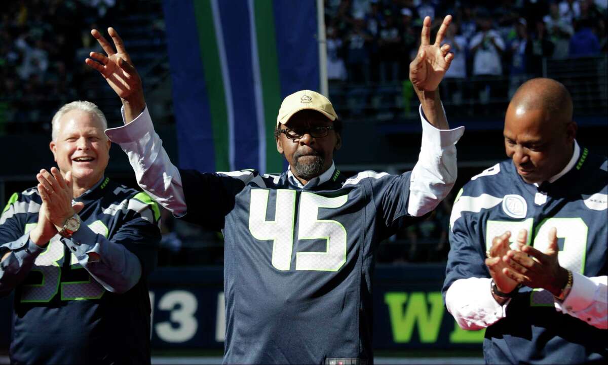FILE - In this Sept. 27, 2015, file photo, former Seattle Seahawk Kenny Easley (45) is recognized during a halftime celebration of the team's 40th anniversary, during an NFL football game against the Chicago Bears in Seattle. The day that Easley reconciled with the Seahawks happened in 2002 and began another lengthy quest that finally landed the hard-hitting All-Pro safety a spot in the Pro Football Hall of Fame. Easley will be the fourth Seattle Seahawks player inducted, going into Canton on Saturday as this yearÂ?’s senior candidate. (AP Photo/John Froschauer, File)