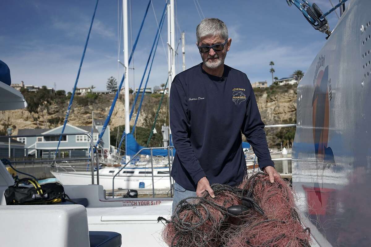 In this Monday, Nov. 30, 2015 photo, Capt. David Anderson of Captain Dave’s Dolphin and Whale Watching Safari in Dana Point, Calif., shows a net a whale was found entangled in. Anderson was among the first to realize whale entanglements were a serious problem when his tours kept running into distressed whales. This year alone, more than 60 entangled whales have been spotted along the coast, a more than 400 percent spike over normal and a pattern that began in 2014. (AP Photo/Christine Armario)