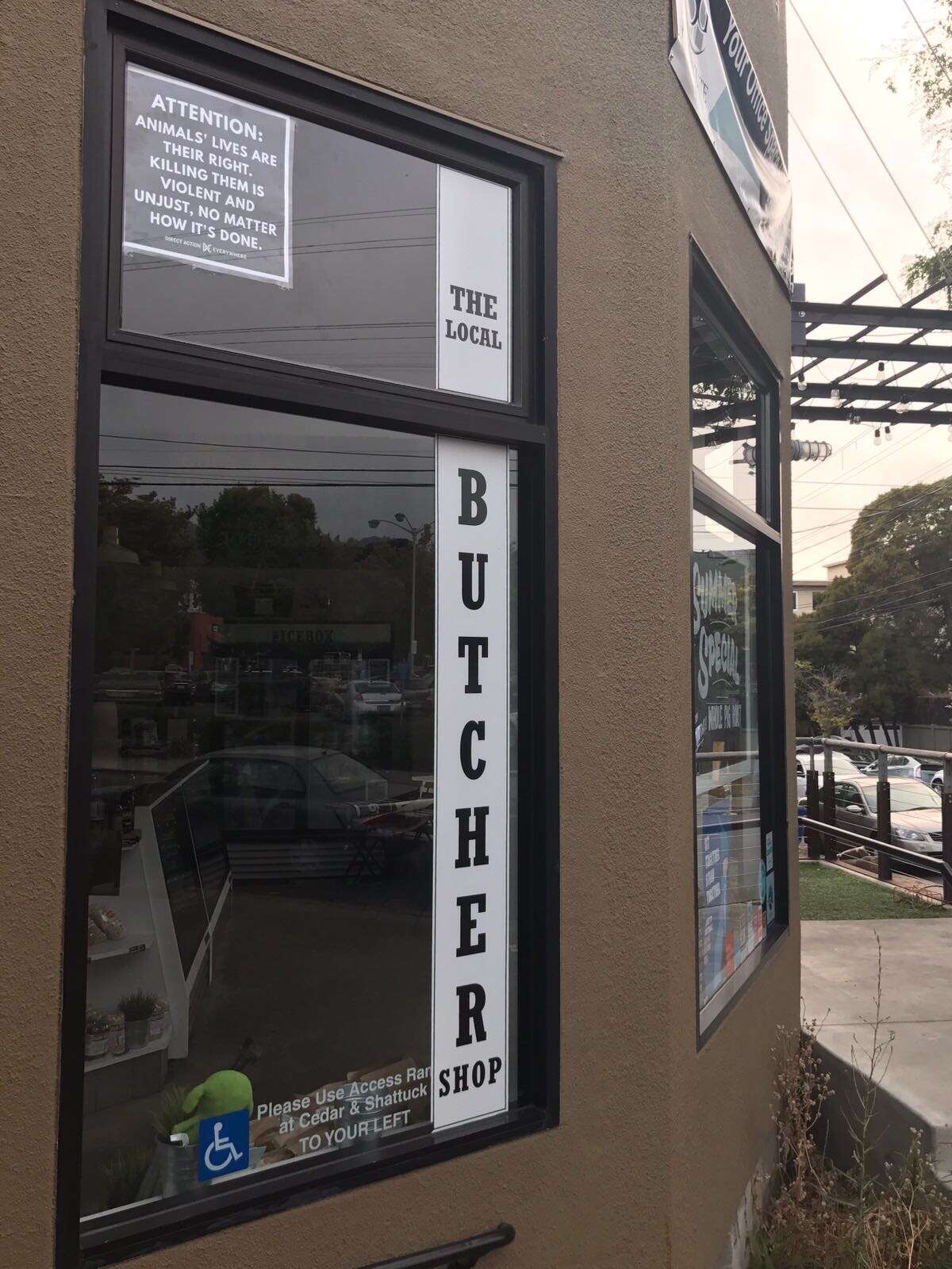A sign in the window of The Local Butcher Shop in Berkeley reads: "Attention: Animals' lives are their right. Killing them is violent and unjust, no matter how it's done." The store displayed the sign in exchange for the halting of weekly protests outside the shop organized by animal rights group Direct Action Everywhere.