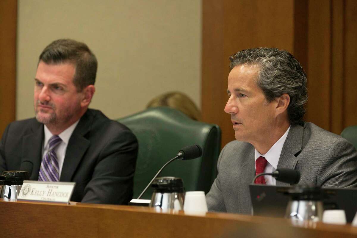 Chairman Kelly Hancock, right, speaks at the Senate Committee on Business and Commerce at the Capitol on Saturday, July 22, 2017 in Austin, Texas. The committee took up SB 8 which relates to health plan and benefit coverage for elective abortion. At left is Sen. Brandon Creighton.(Deborah Cannon/Austin American-Statesman via AP)