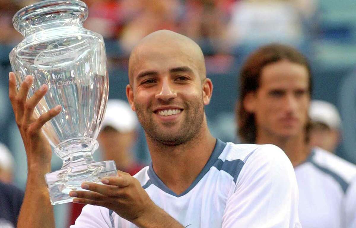 James Blake with the trophy after winning the Pen Tennis Tournament men's finals Championship match against Feliciano Lopez. Photograph by Peter Hvizdak 8/28/05: