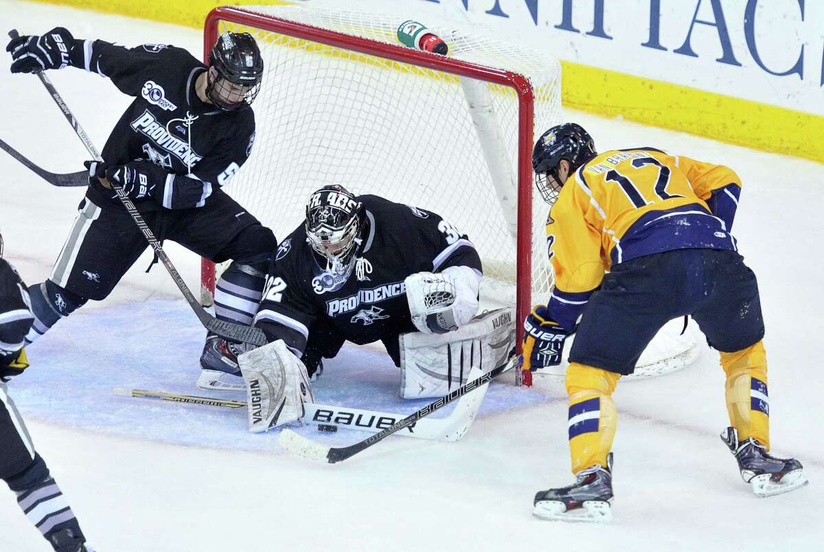 (Peter Casolino — New Haven Register) Providence's Goalie Jon Gillies makes the stop with help from Kyle McKenzie as Quinnipiac's Bryce Van Brabant follows up the shot during the 2nd period. pcasolino@NewHavenRegister