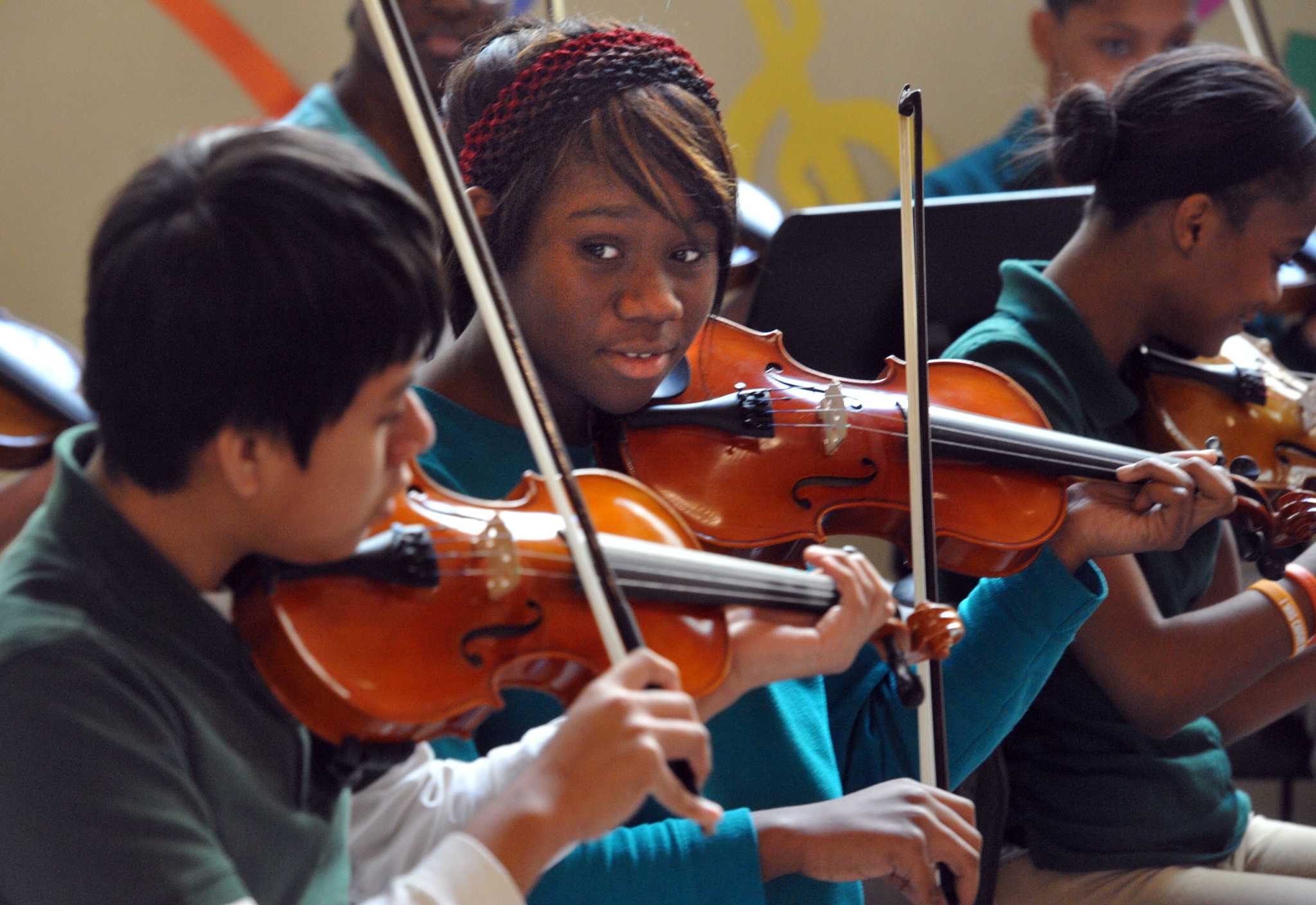 Photos of Augusta Lewis Troup Students with Donated Musical Instruments