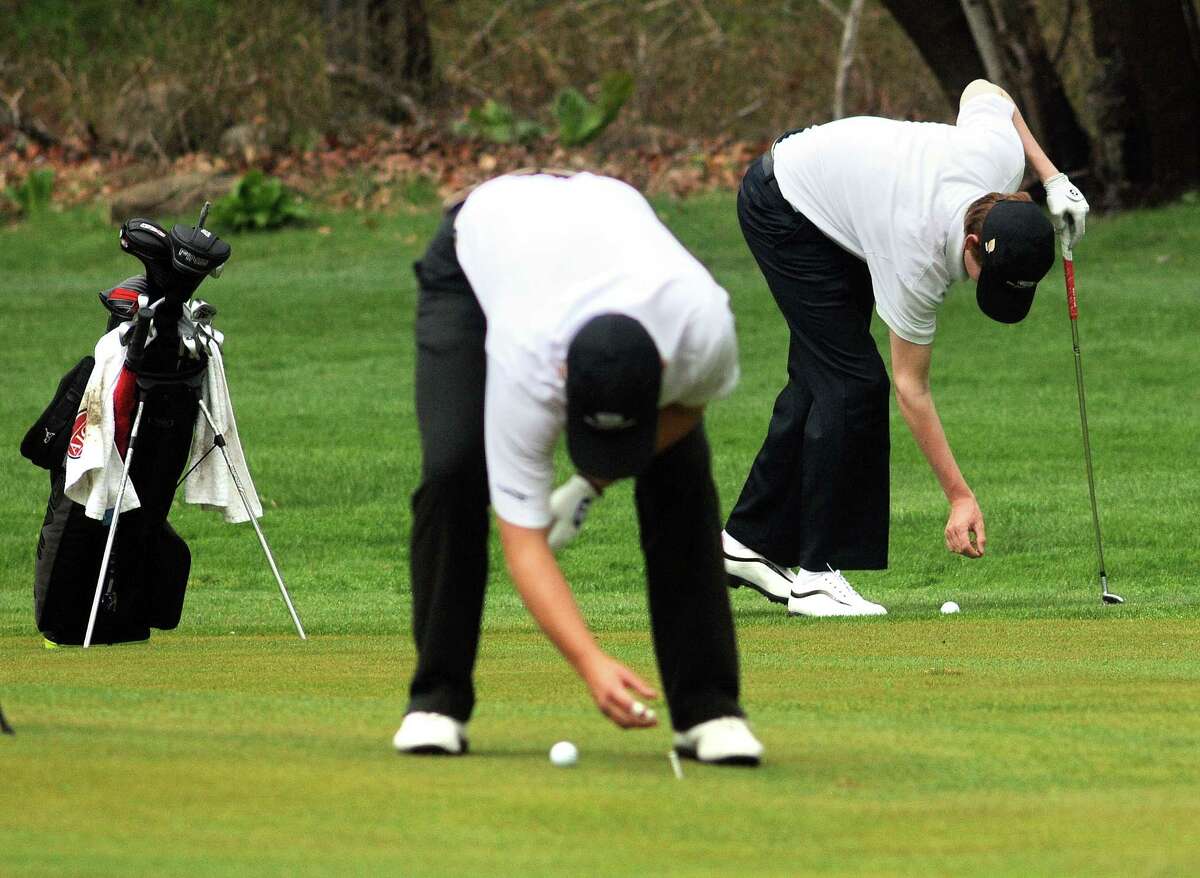 (Mara Lavitt ?‘ New Haven Register) May 1, 2014 Hamden Pomperaug's John VanDerLaan, left and Daniel Hand's Brian Carlson competing in the Challenge Cup Golf Tournament at the New Haven Country Club. mlavitt@newhavenregister.com