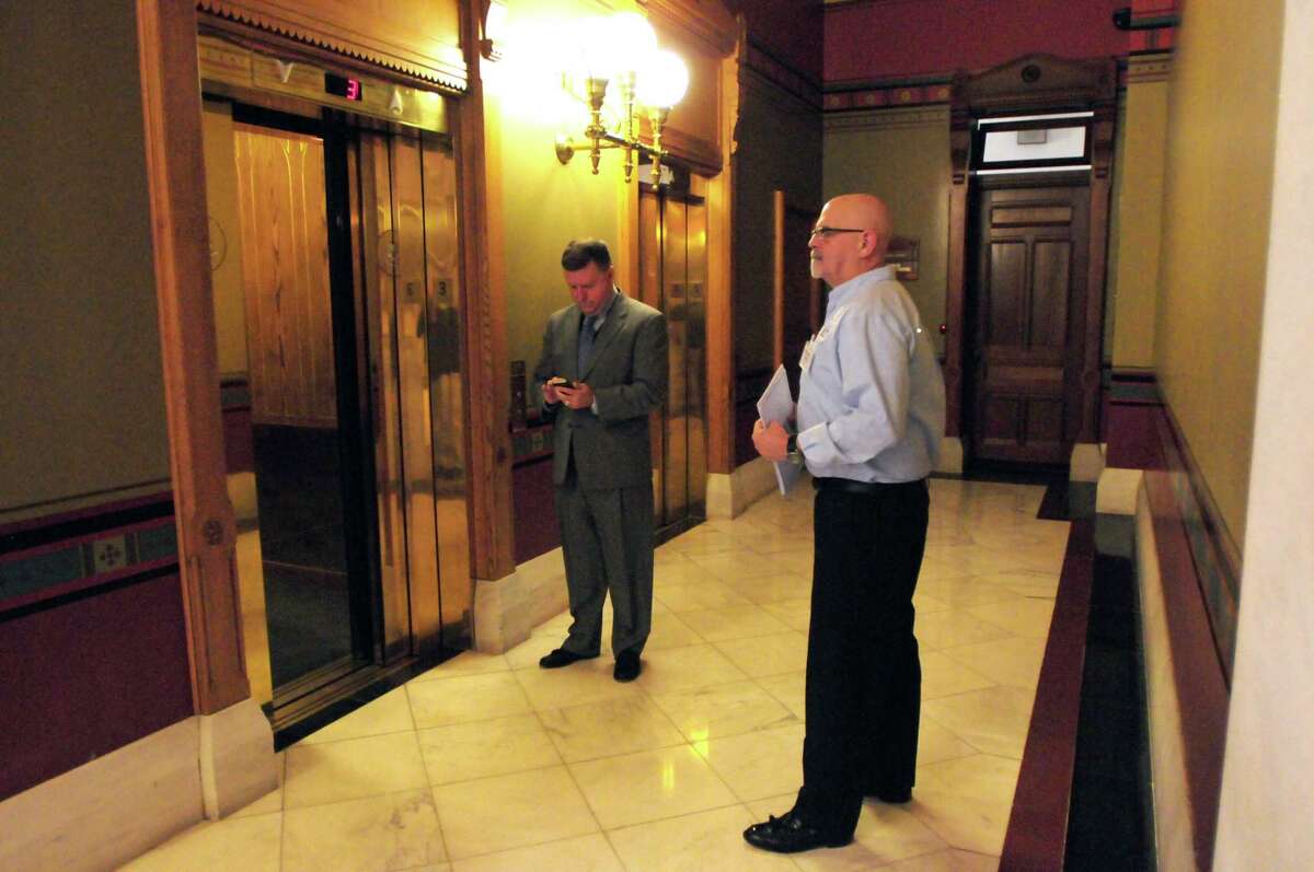 (Peter Hvizdak - New Haven Register) David Koch of Hamden, waiting for an elevator at the State Capitol on his way to lobby in the Legislative Office Building. Koch, a 17-year volunteer with the American Cancer Society Cancer Action Network (ACS CAN), a non-Hodgkins Lymphoma cancer survivor who, along with approximately 100 other cancer patients, survivors and caregivers from around the state, are in Hartford Tuesday, April 1, 2014 to lobby Connecticut lawmakers about the need to make cancer issues a top priority in the legislature. The visit is part of the annual American Cancer Society Cancer Action Network Lobby Day. a 17-year volunteer with the American Cancer Society Cancer Action Network (ACS CAN), a non-Hodgkins Lymphoma cancer survivor who, along with approximately 100 other cancer patients, survivors and caregivers from around the state, are in Hartford Tuesday, April 1, 2014 to lobby Connecticut lawmakers about the need to make cancer issues a top priority in the legislature. The visit is part of the annual American Cancer Society Cancer Action Network Lobby Day.