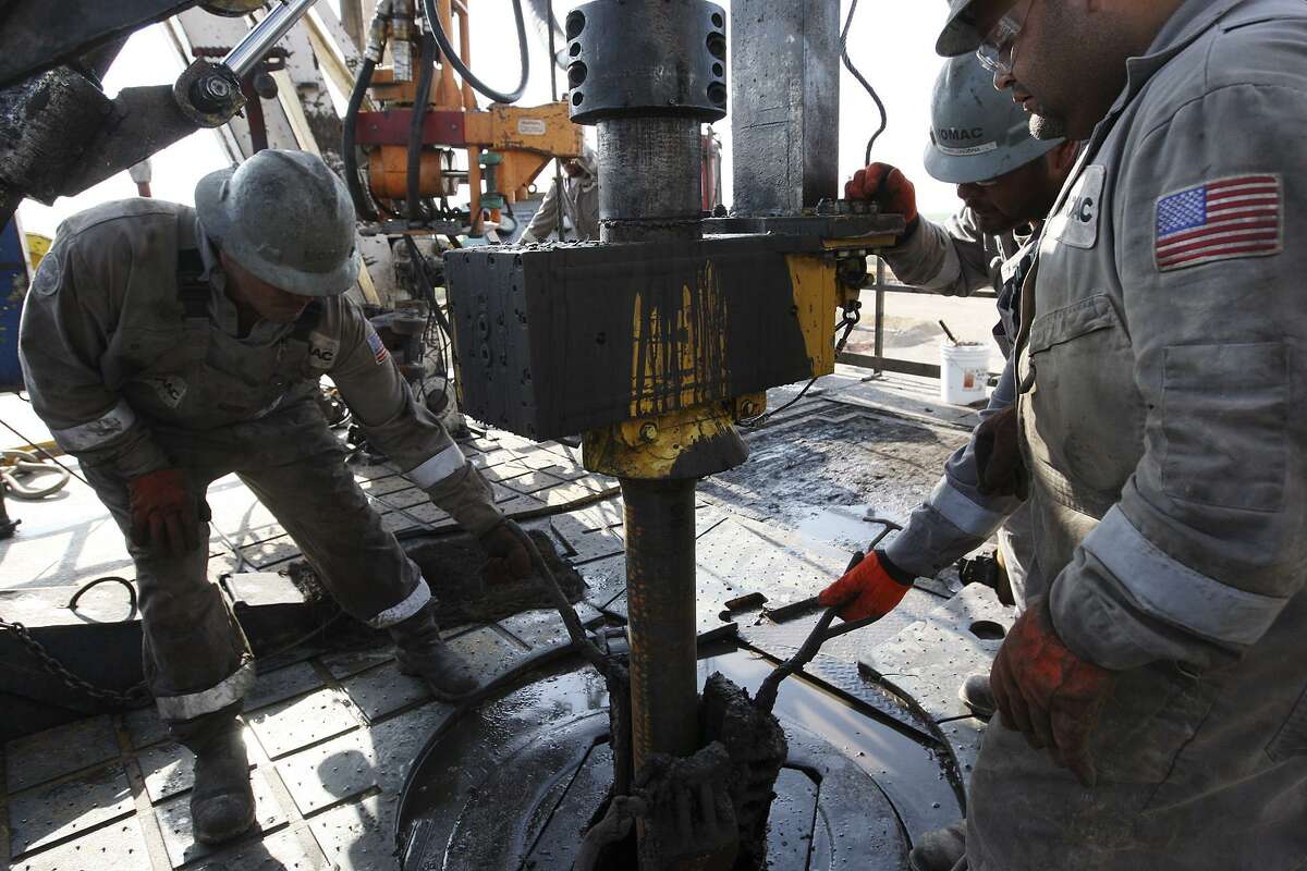 METRO -- Oilfield workers drill at a site near Carriso Springs at a well owned by Chesapeake Energy, Thursday, April 5, 2012. Jerry Lara/San Antonio Express-News