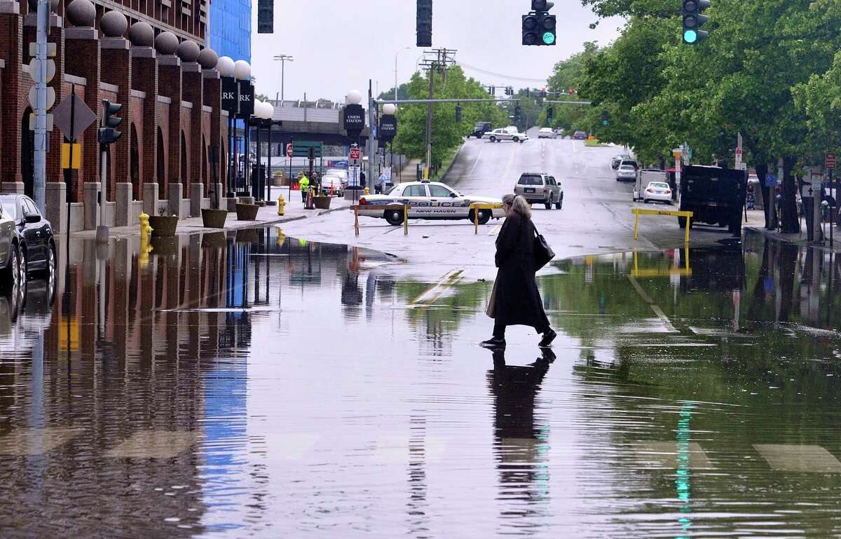 Flooding closes streets in New Haven area; creates manhole ‘geyser’