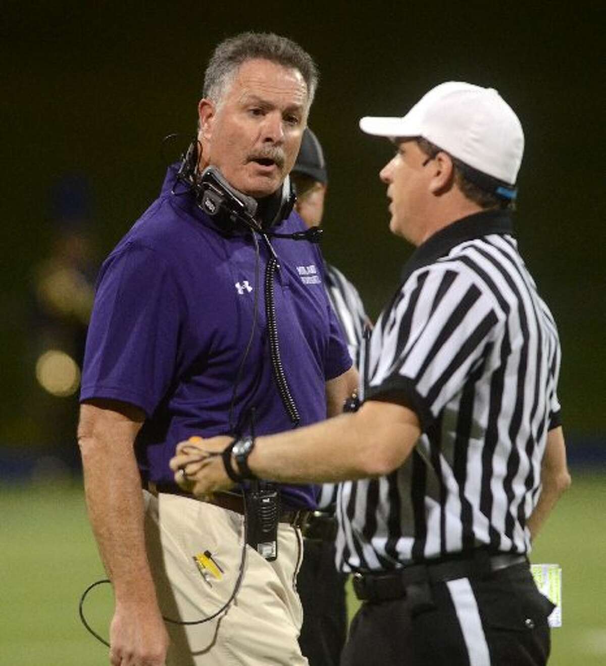 Former Midland High head football coach Craig Yenzer talks to an official during a game against El Paso Franklin on Friday, Sept. 9, 2014 at Grande Communications Stadium. James Durbin/Reporter-Telegram