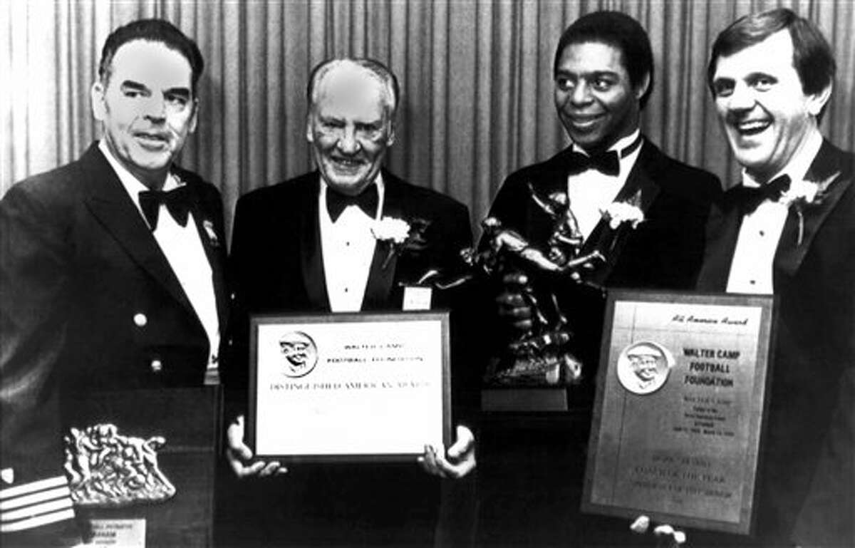 The award recipients for the Walter Camp Football Foundation are shown with their awards before the start of the annual dinner in New Haven, Connecticut on Feb. 6, 1982. From left are: Otto Graham, Man of the Year, of the U.S. Coast Guard Academy; Harold “Red” Grange distinguished American of the Year; Marcus Allen, Walter Camp Player of the Year of USC; Jackie Sherrill, Coach of the Year, former head football coach at Pitt and now athletic director and coach at Texas A&M.
