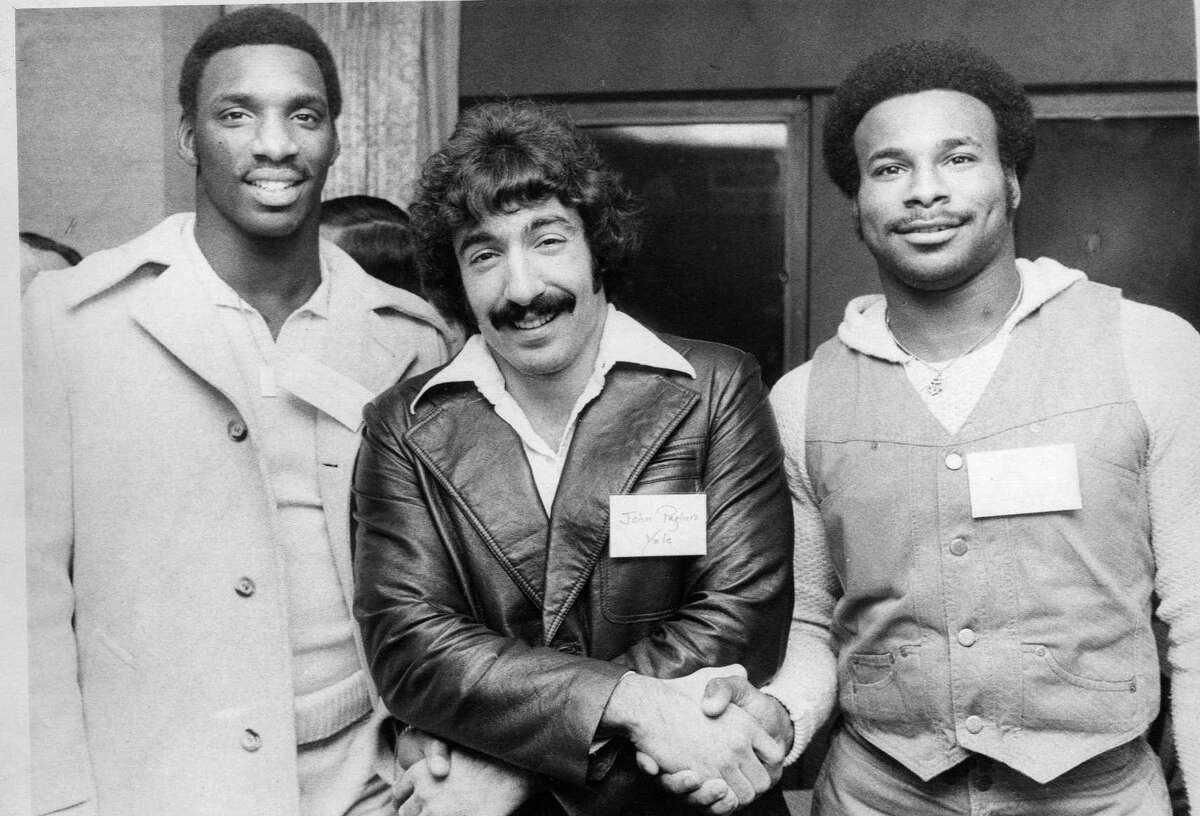 Yale running back John Pagliaro (center) of Derby with Grambling quarterback Doug Williams (at left) and LSU running back Charles Alexander at the 1977 Walter Camp All-America dinner.