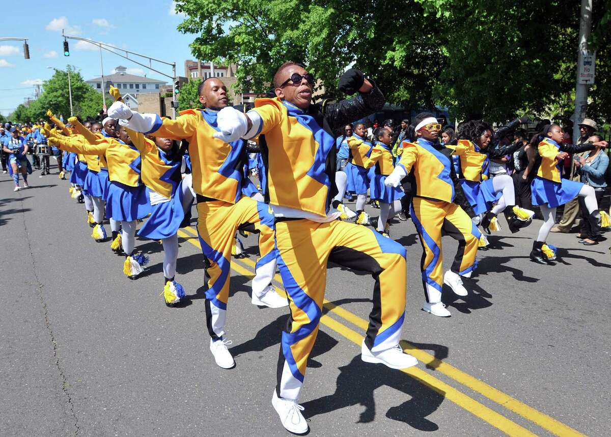 (Peter Casolino-New Haven Register) Members of the Fusion Drill Team (out of New Haven) dance in the annual Freddie Fixer parade along Dixwell Avenue, from Hamden to New Haven. 5/18/14 pcasolino@newhavenregister.com