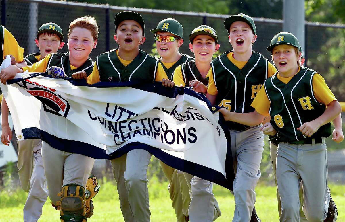 The Hamden Dragons take a victory lap around Dewitt Jones Field in New Haven following their 17-3 win in 4 innings over the Branford All Stars in the District 4 championship game, Saturday, July 11, 2015. (Catherine Avalone/New Haven Register)