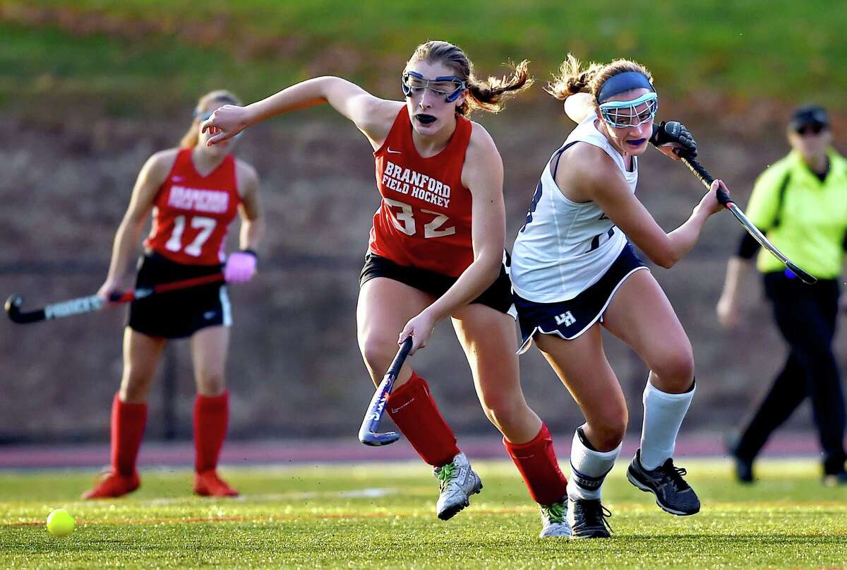 Branford midfielder Autumn McHenry and Lauralton Hall senior Madelyn Monahan battle for a loose ball Tuesday, November 1, 2016, during an SCC semifinal game ending in a 4-1 shootout win for the Hornets following a 1-1 tie in regulation and a scoreless triple overtime in Milford. (Catherine Avalone/New Haven Register)