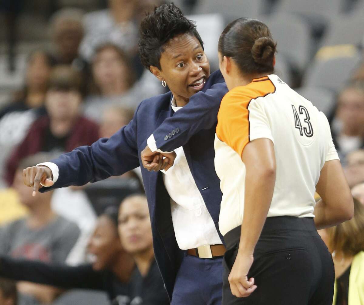 Stars head coach Vickie Johnson tries to get a call from official Brenda Pantoja in WNBA game between the Stars and New York Liberty at the AT&T Center on Tuesday, Aug. 1, 2017