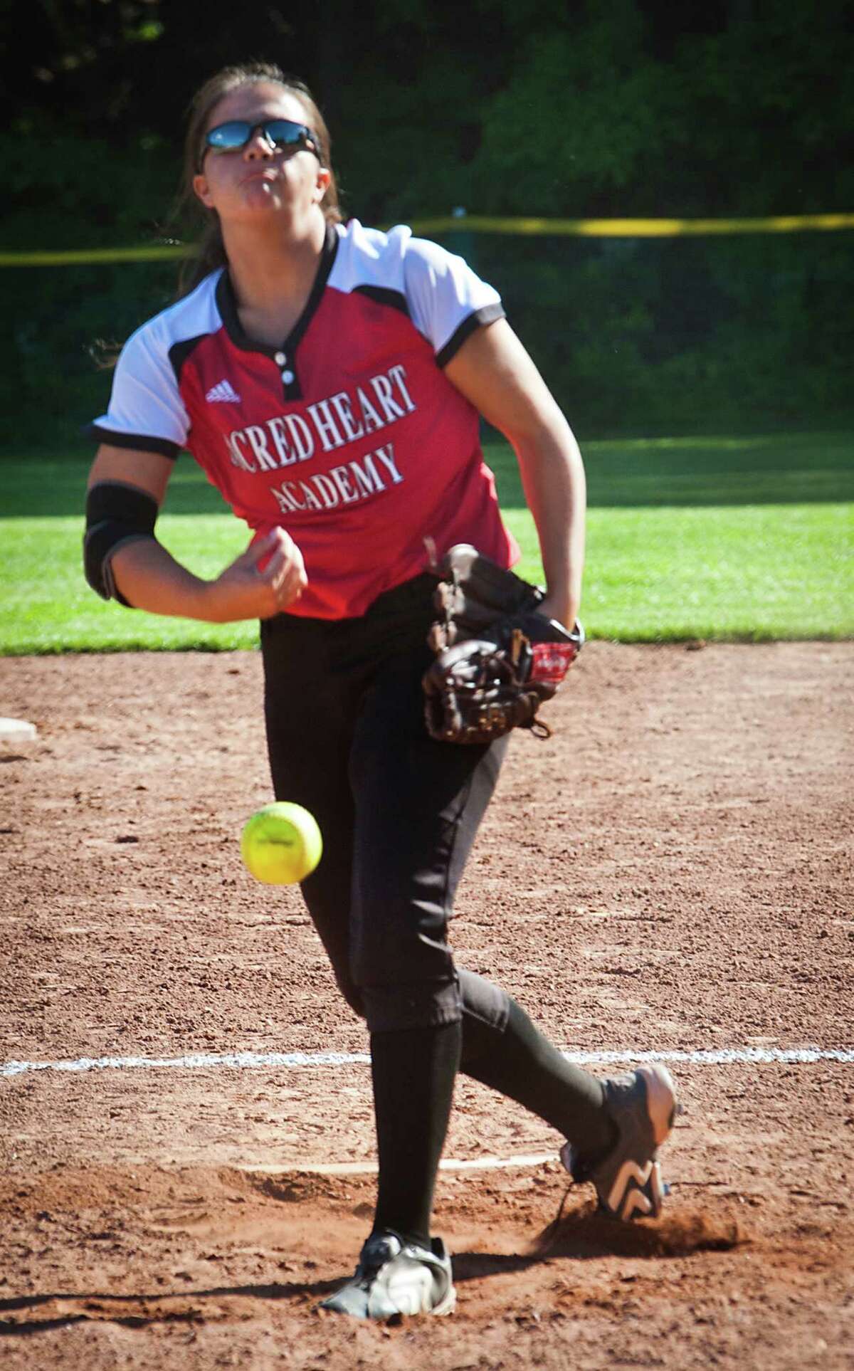 (Melanie Stengel - New Haven Register) Sacred Heart catcher Molly Flowers holds Law to just run 6/6.