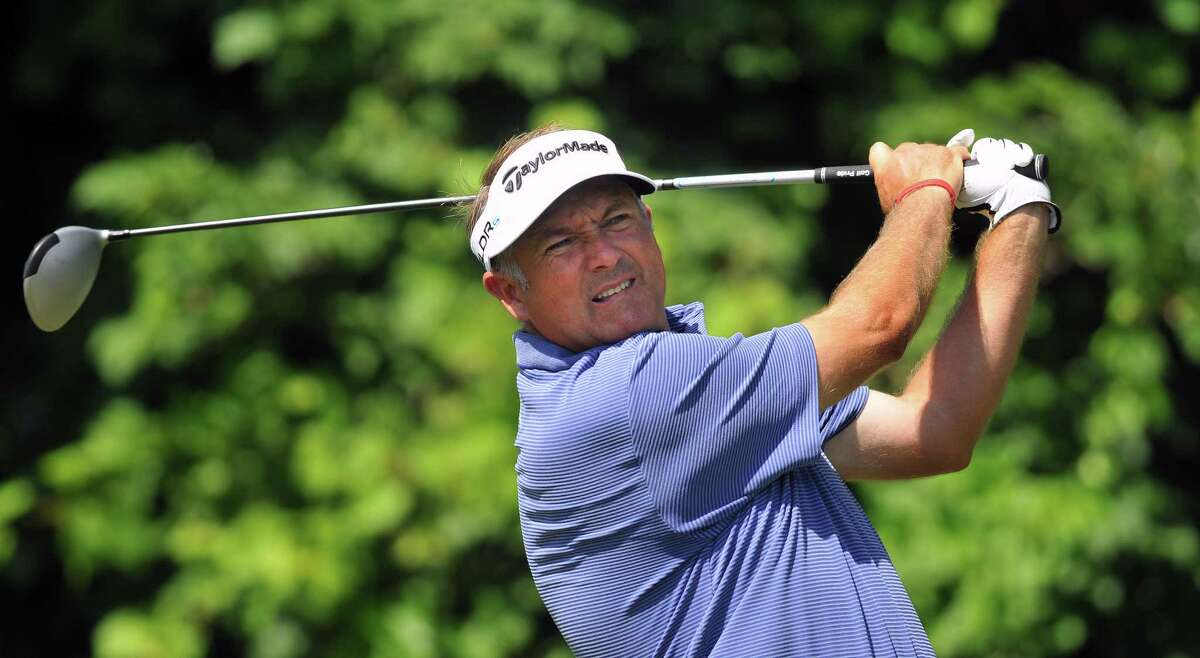 (Peter Casolino-New Haven Register) 2013 Champion Ken Duke tees off on the 12th hole during the Travelers Championship Pro-Am. June 18, 2014. pcasolino@newhavenregister.com