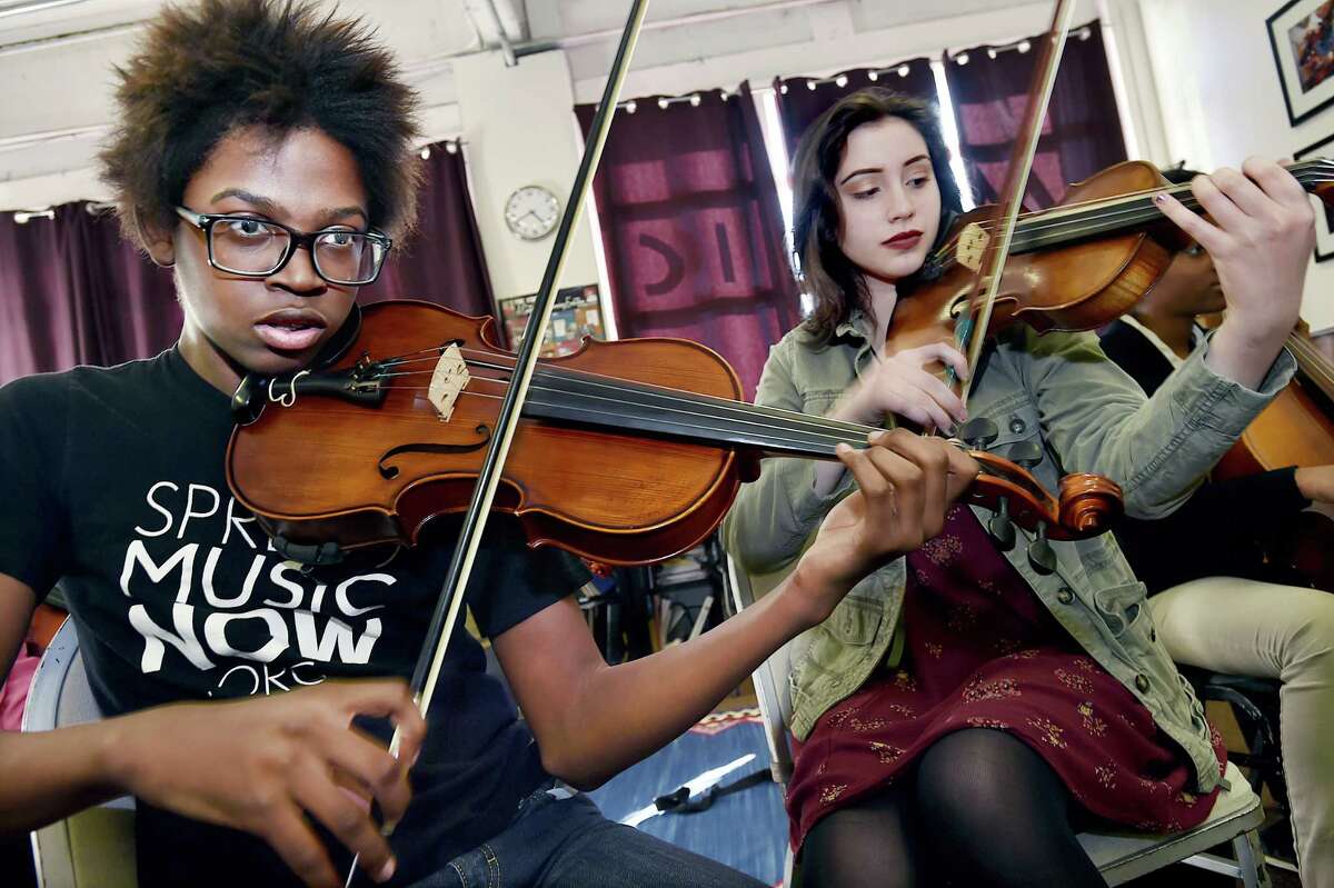 Violist Robert Oakley, 17, a member of Harmony in Action, a youth chamber orchestra, practices Friday, March 17, 2017, under the direction of resident cellist Philip Boulanger at Music Haven on Whalley Avenue in New Haven. Music Haven's resident ensemble, the Haven String Quartet provides a tuition-free music education program to students living in underserved New Haven neighborhoods.