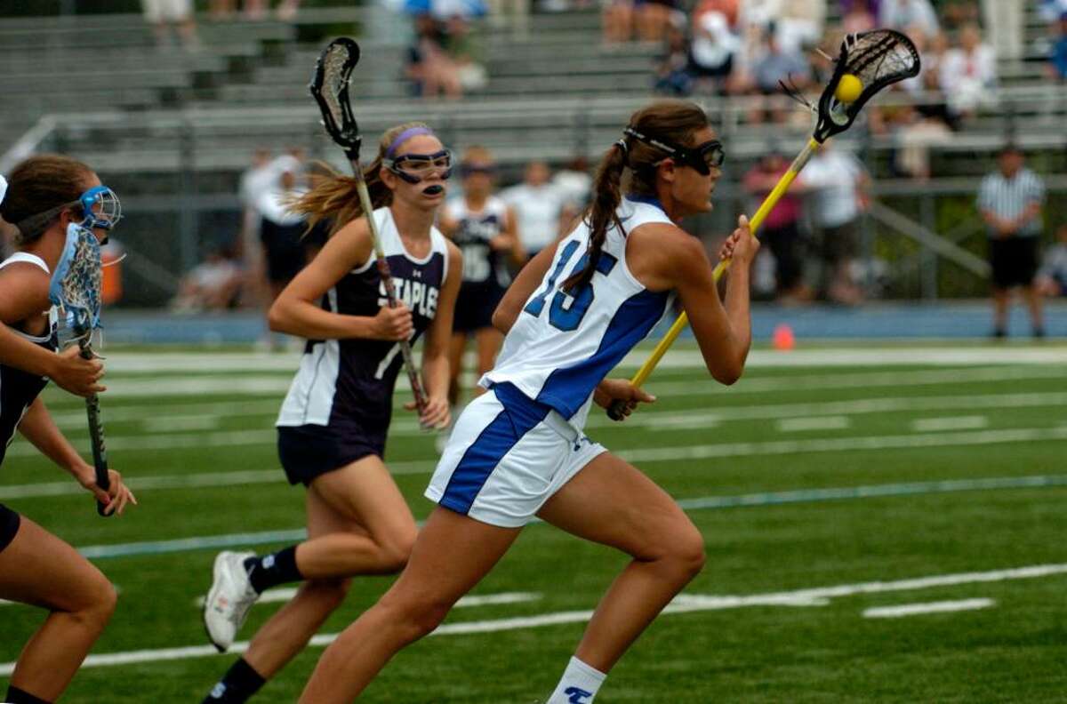 Sarah Nesi of Fairfield Ludlowe High School controls the ball during the girls lacrosse Division II final game against Staples High School at Bunnell High School Saturday, June 12, 2010.