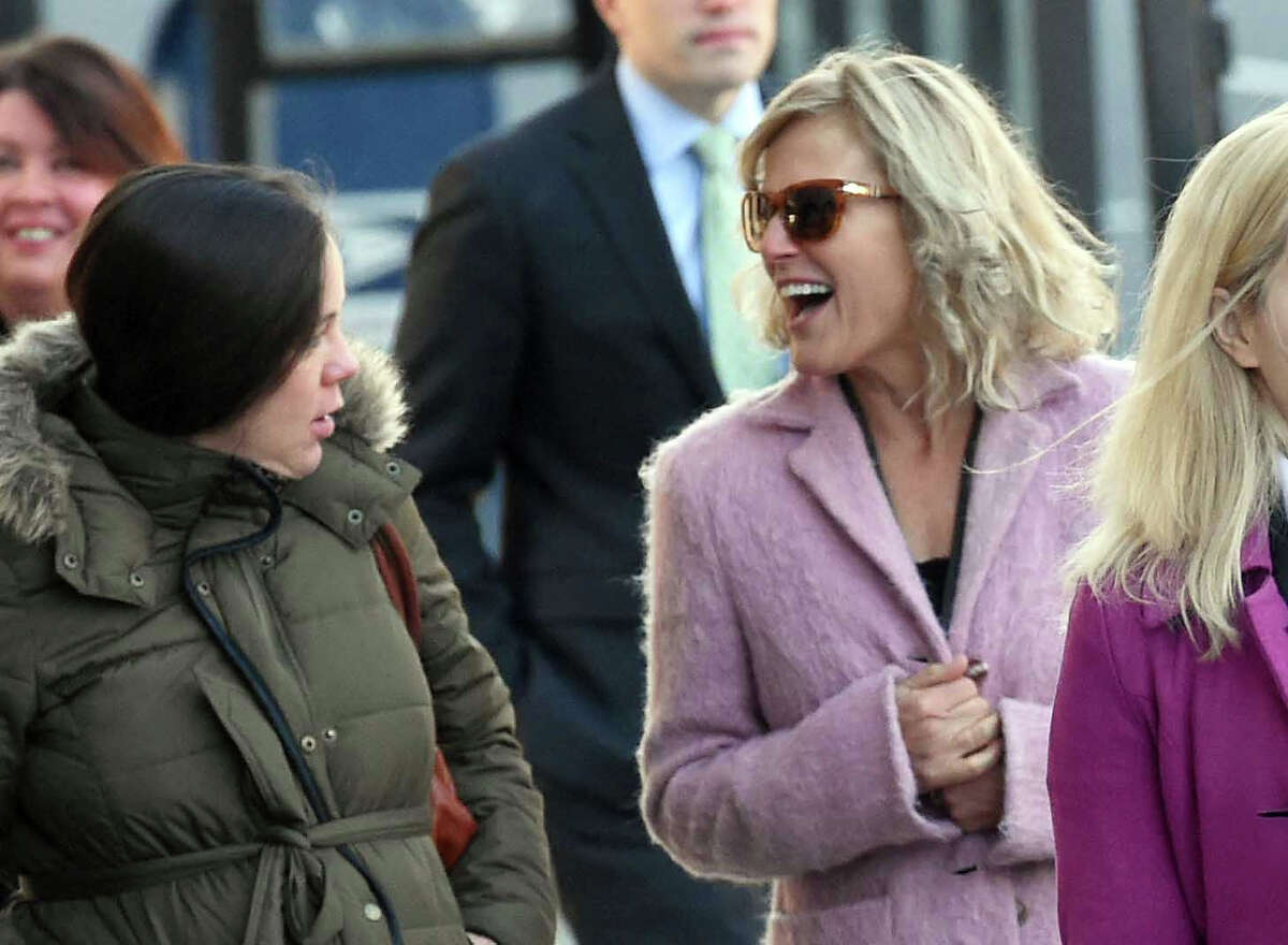 (Peter Hvizdak - New Haven Register) Former Congressional candidate Lisa Wilson-Foley, right, arrives at the Federal Courthouse in New Haven Tuesday, March 24, 2015 for her sentencing in hiding a campaign consulting relationship with former Governor John Rowland.