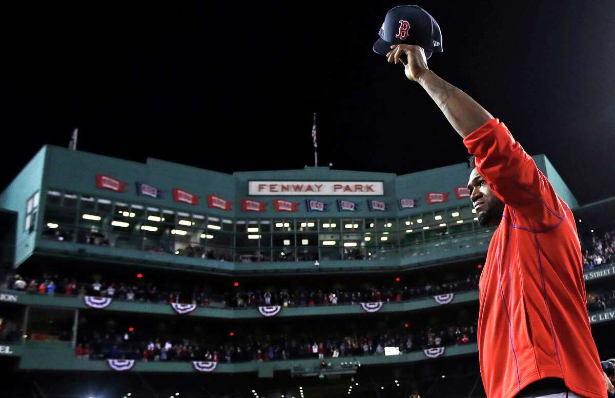 Boston Red Sox's David Ortiz waves from the mound at Fenway Park after Game 3 of baseball's American League Division Series against the Cleveland Indians, Monday, Oct. 10, 2016, in Boston. The Indians swept the Red Sox out of the postseason and sent Ortiz into retirement with a 4-3 victory that completed a three-game American League Division Series sweep.