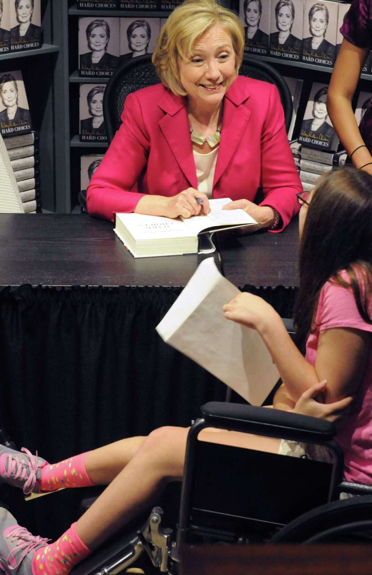 (Mara Lavitt ?‘ New Haven Register) July 19, 2014 Madison R.J. Julia Booksellers in Madison hosted a Hillary Clinton book signing for her book "Hard Choices." At least a thousand people got their copies signed. Clinton met Sullivan Bono of Guilford who talked to Clinton about Dystonia, a condition Bono has. mlavitt@newhavenregister.com