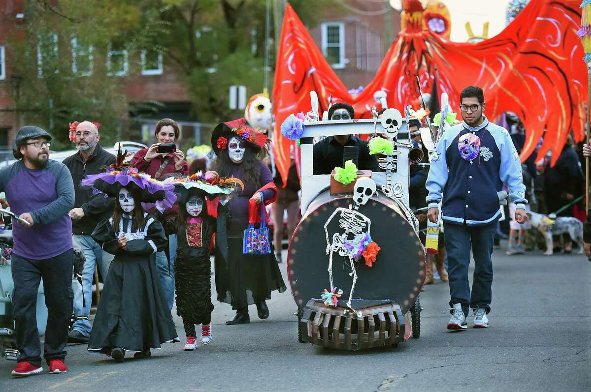 The Carnaval del Dia de los Muertos - Day of the Dead parade sponsored by Unidad Latina en Accion and Esperanza Center for Law and Advocacy makes its way down Saltonstall Avenue in New Haven, Saturday, November 5, 2016. (Catherine Avalone/New Haven Register)