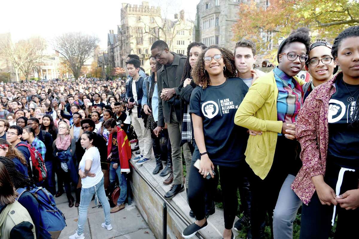Members of the Black Student Alliance at Yale (right) and other Yale University students and faculty rally to demand that Yale University become more inclusive to all students on Cross Campus in New Haven on 11/9/2015. Photo by Arnold Gold/New Haven Register agold@newhavenregister.com