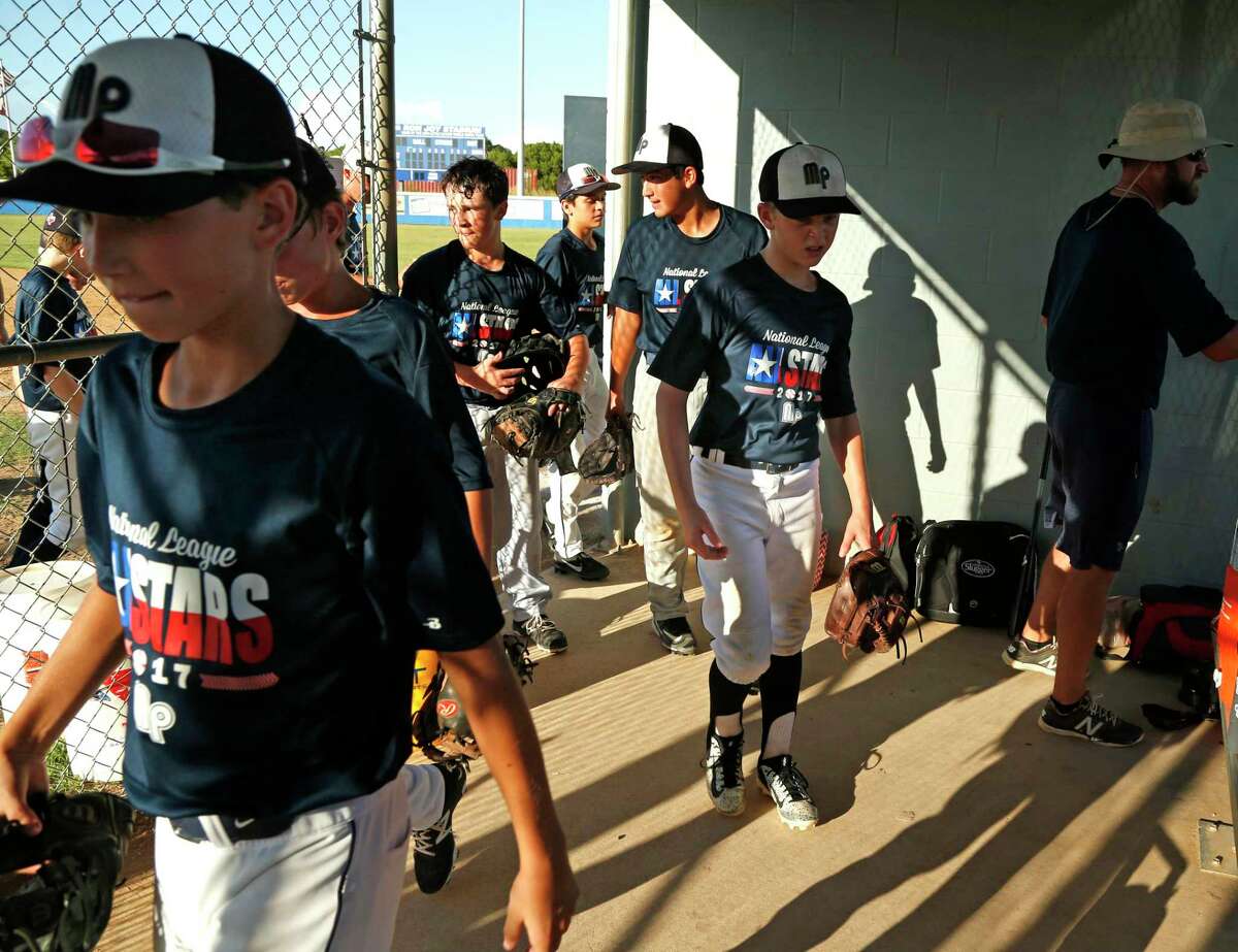 McAllister Park Little League team comes in for a break on July 26, 2017, during preparation for the Southwestern Regional tournament.