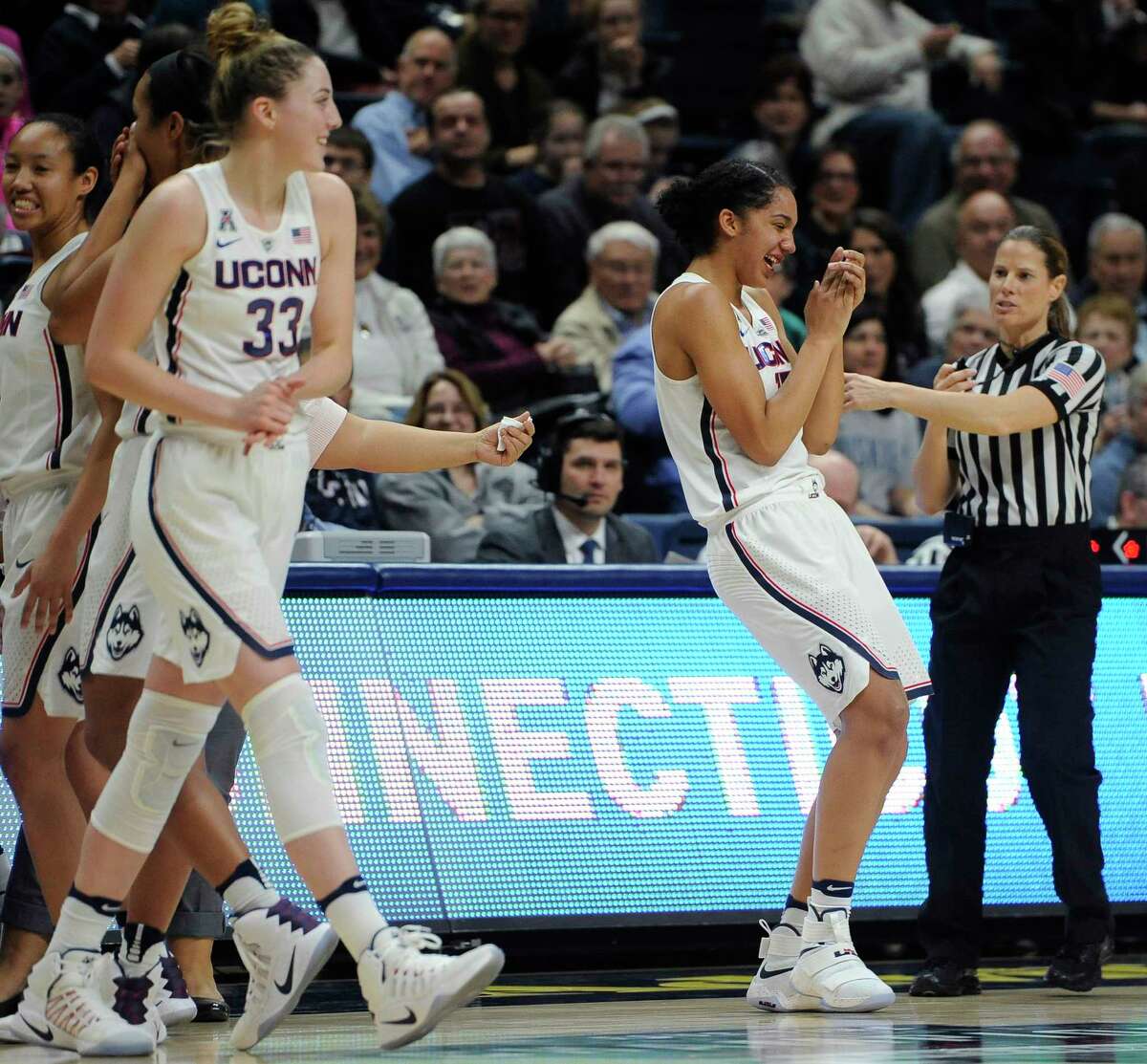 Connecticut's Gabby Williams, front right, reacts after taking an elbow to her tooth in the second half of an NCAA college basketball game against Tulane, Sunday, Jan. 22, 2017, in Storrs, Conn.