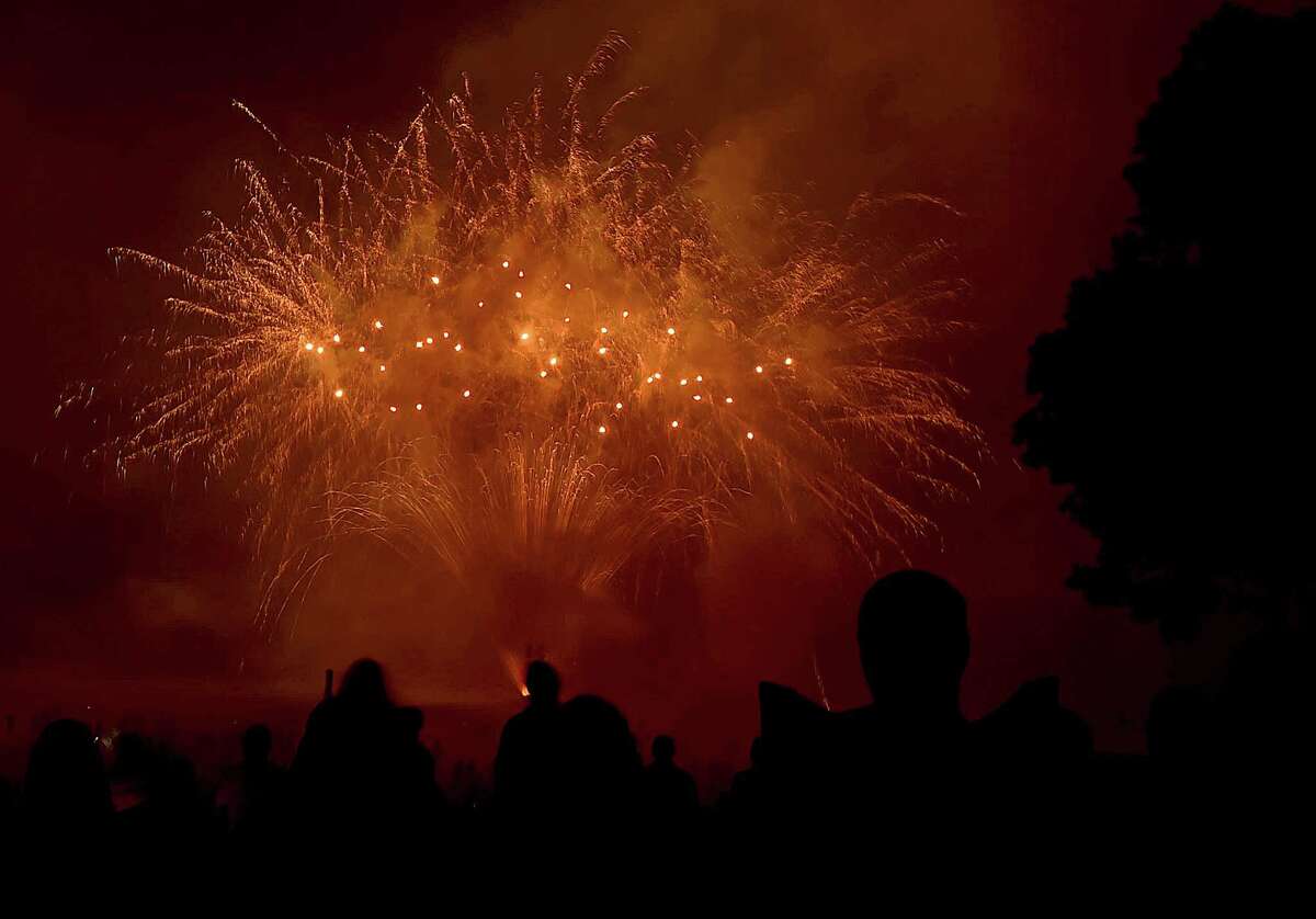 Hundreds of residents return to the firework bonanza at Hamden Town Center Park on Dixwell Avenue following the thunderstorm, Friday, June 30, 2017. (Catherine Avalone / Hearst Connecticut Media)