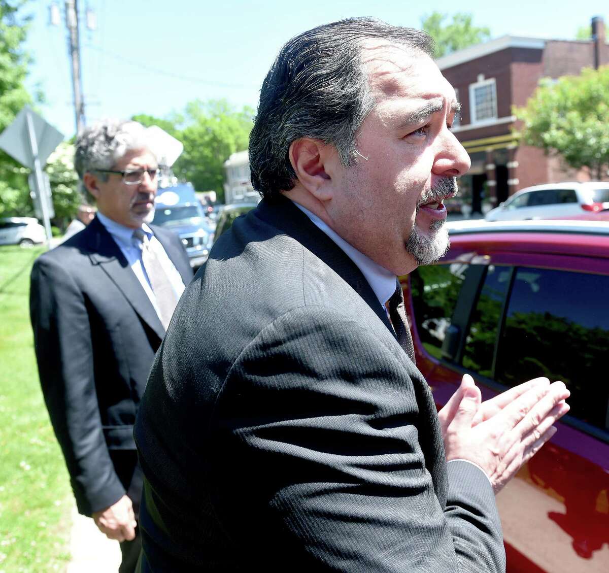 Jose Sanchez (right), father of Maren Sanchez, speaks with the press accompanied by his attorney, Anthony Bonadies (left), outside of Milford Superior Court after the sentencing of Christopher Plaskon on 6/6/2016. Photo by Arnold Gold/New Haven Register agold@newhavenregister.com