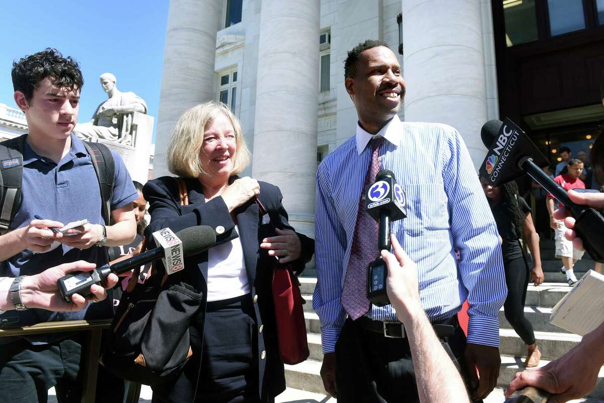 Corey Menafee (right) leaves Superior Court in New Haven accompanied by his attorney, Patricia Kane, on 7/26/2016. Photo by Arnold Gold/New Haven Register agold@newhavenregister.com