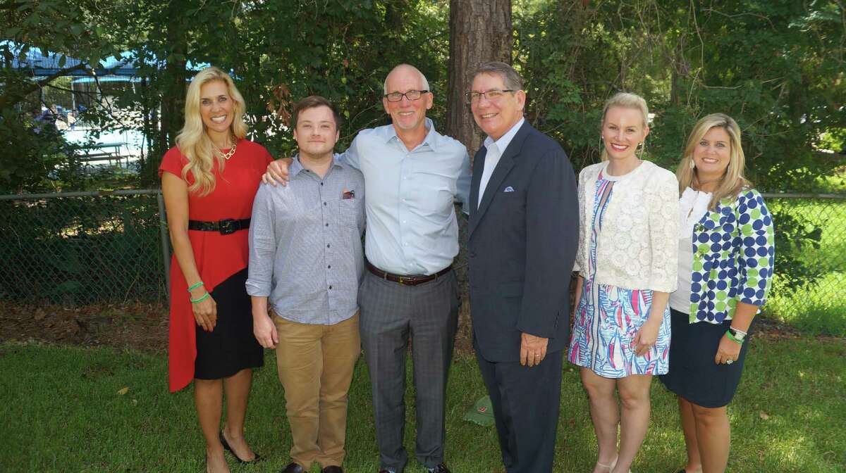 Missy Herndon (left), president and CEO of Interfaith of The Woodlands, congratulates Rob Johnson (center) for being named a 2017 Hometown Hero, pictured with Matt Johnson, (second from left), Dr. Daniel T. Hannon, 2008 Hometown Hero, (third from right), Meagan Jamaluddin, director of Development, Interfaith of The Woodlands (second from right) and Shannon Mills, director of Communications & Publications, Interfaith of The Woodlands (far right).