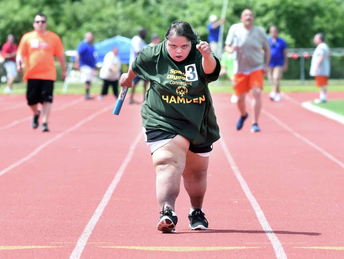 Law enforcement officers, track students unite for Special Olympics run