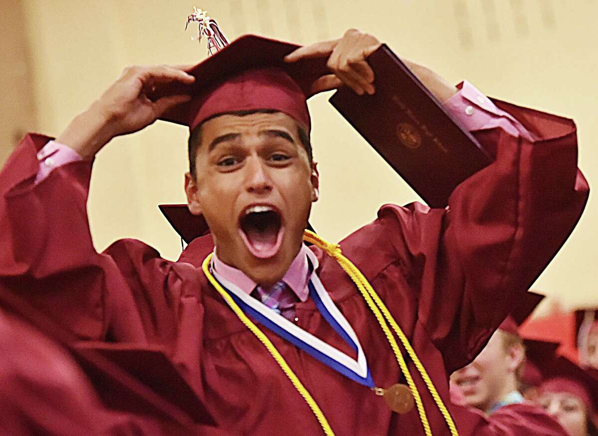Omar Gebril celebrates as the North Haven High School's class of 2017 prepares for the recessional at graduation, Wednesday, June 21, 2017, at the Frederick J. Kelly Gymnasium at North Haven High School. (Catherine Avalone / Hearst Connecticut Media)