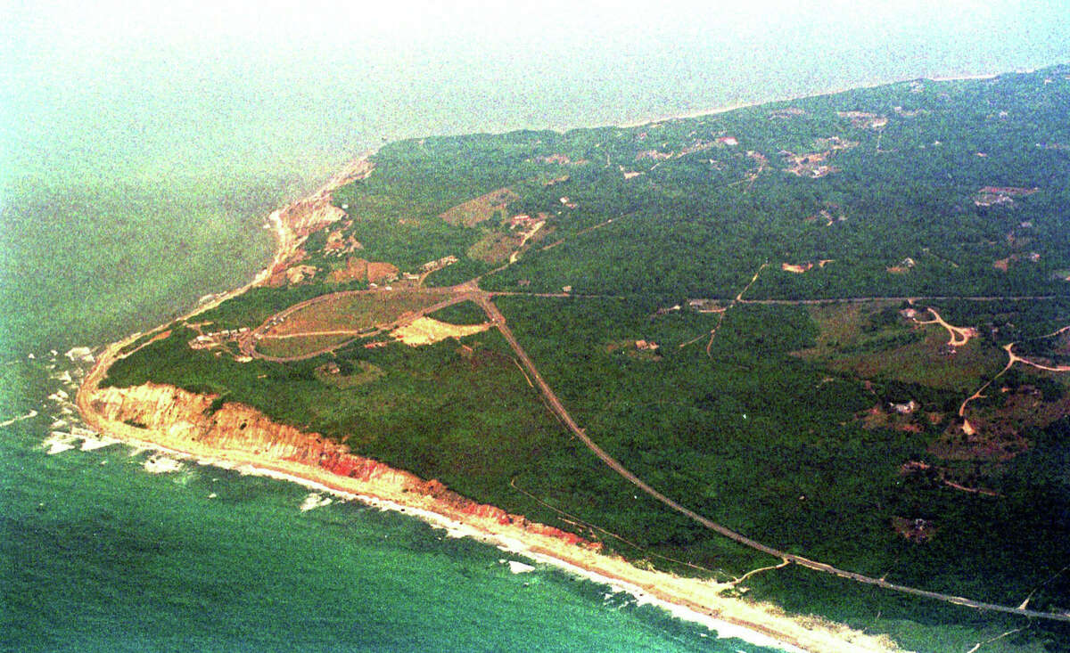 This Sunday, July 18, 1999 aerial photo shows the Gay Head area of Martha's Vineyard shrouded in haze. A vast aerial search of the sea off Martha's Vineyard resumed Sunday after Coast Guard cutters overnight found no signs of John F. Kennedy Jr., his wife and her sister. Their plane was reported missing off the shores off the resort island early Saturday. (AP Photo/Neal Hamberg)