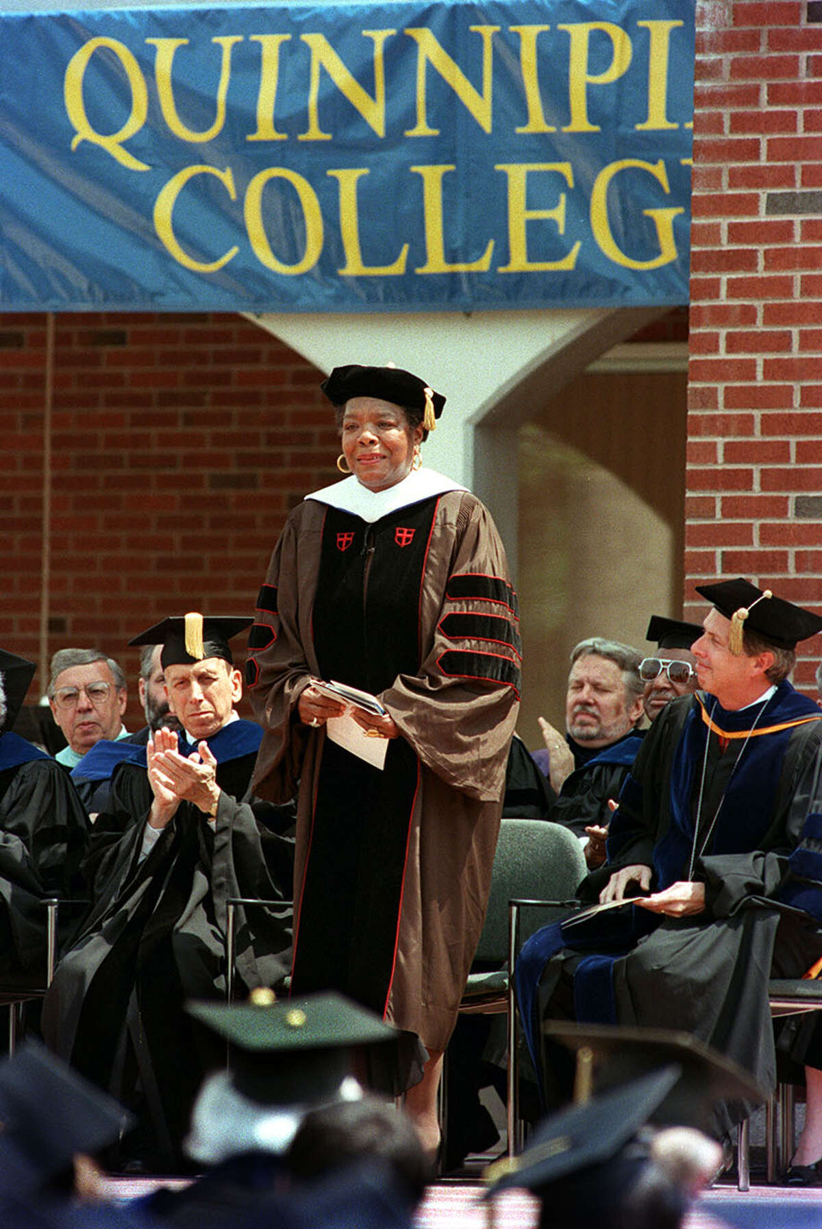 by PETER R. HVIZDAK---------5/19/96 HAMDEN: Quinnipiac College Honorary Degree recipient and Maya Angelou , after giving the commencement address at Quinnipiac College graduation Sunday . SEE ATTACHED.